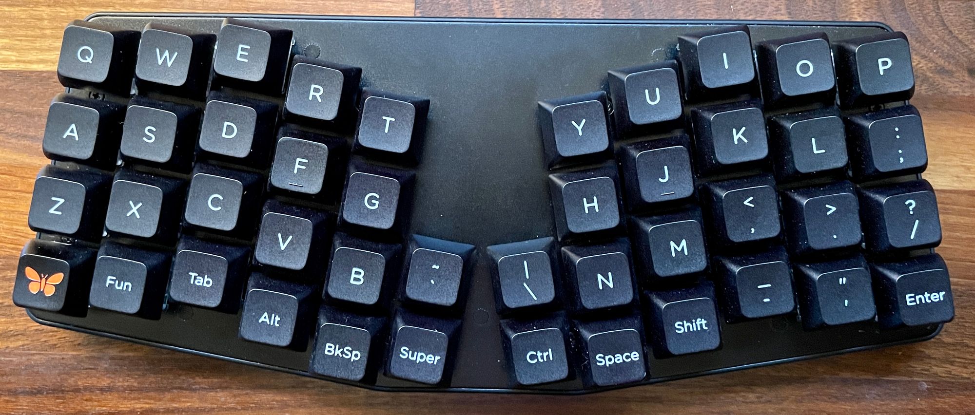I took off all the keycaps and brushed them, but there's still flecks of stuff on it.